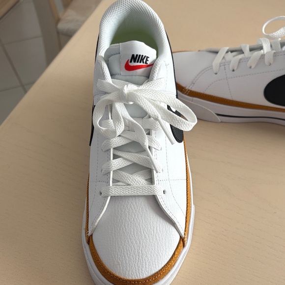 Nike women’s White and Black Sneakers with Gold Accents - Picture 3 of 8